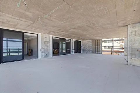 a view of an empty room with a fireplace