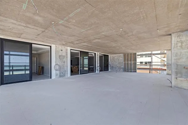 a view of an empty room with a fireplace