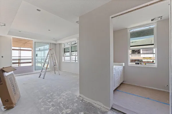 a view of empty room with windows