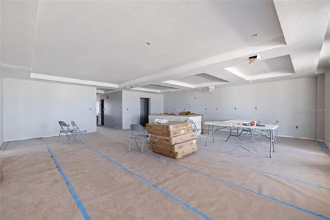 a room with gym equipment and a table