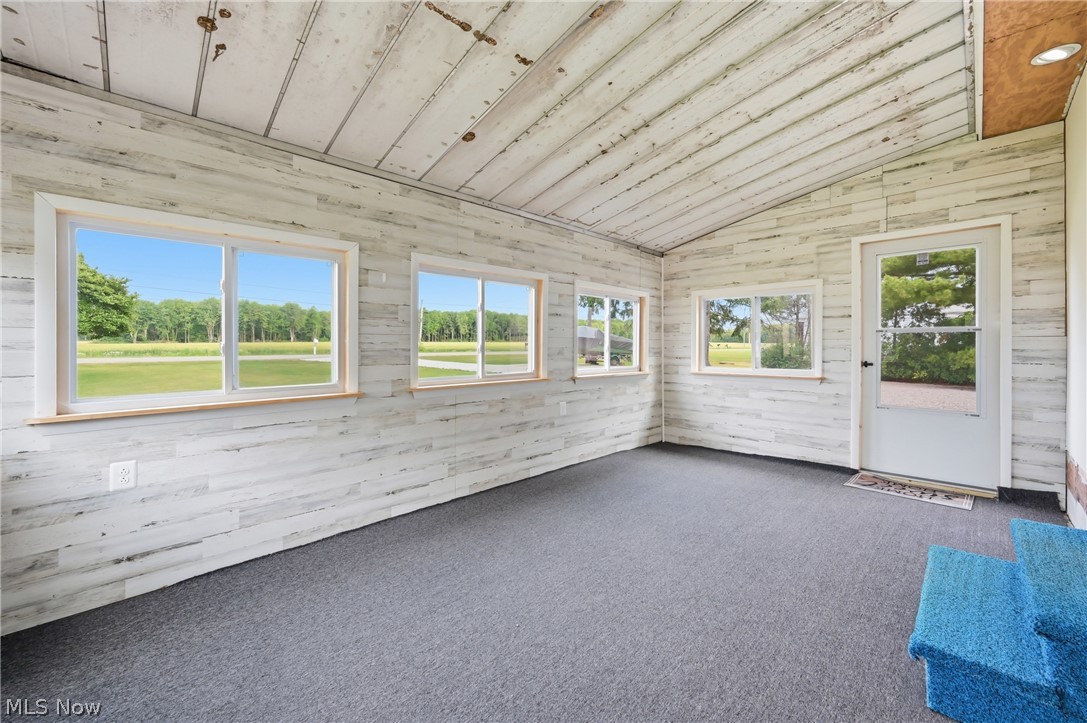 4570 Pymatuning Lake Road Andover, OH 44003 - Photo 10 of 38 Enclosed porch featuring rustic wood-finish paneling, 6 NEW windows