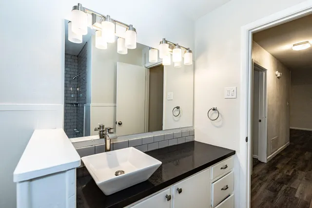 a bathroom with a sink and a mirror