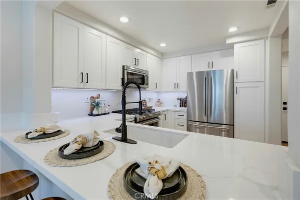 a kitchen with furniture and a sink