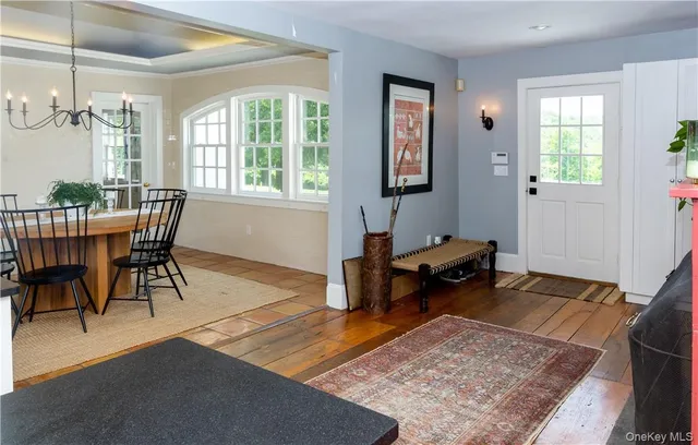 a living room with furniture rug and window