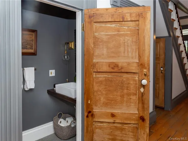 a bathroom with a granite countertop shower and a sink