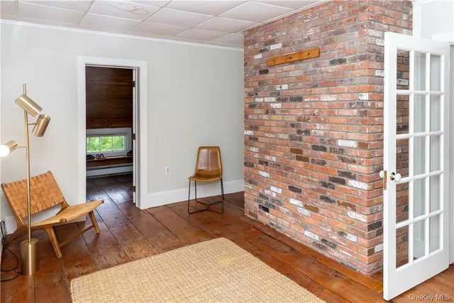 a view of workspace with wooden floor and furniture