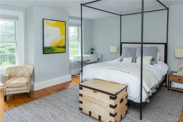 a bedroom with a bed and couch