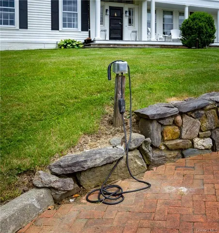 a view of a backyard with plants and patio