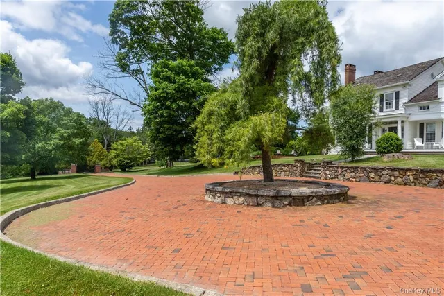 a view of a park with large trees
