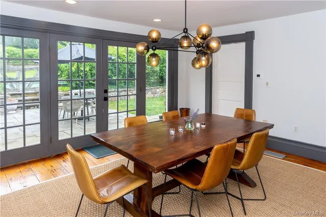 a dining room with a table and chairs
