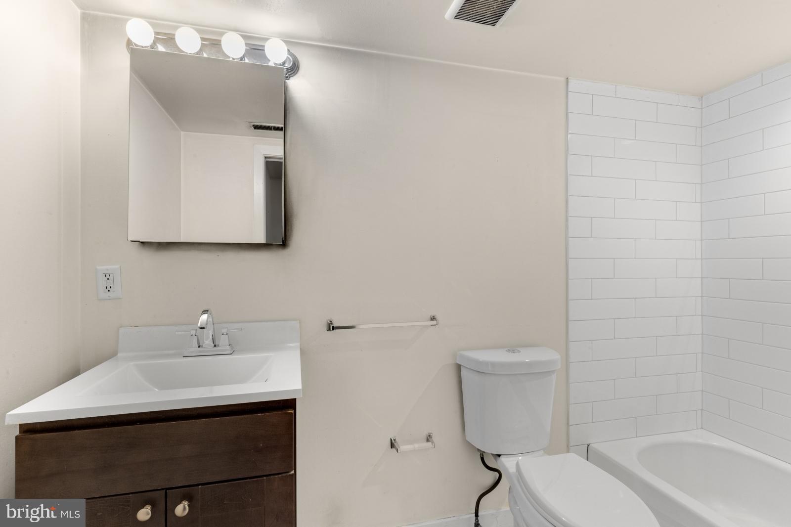 2031 South Juniper Street, Unit 204 Philadelphia, PA 19148 - Photo 11 of 31 a bathroom with a sink toilet and shower