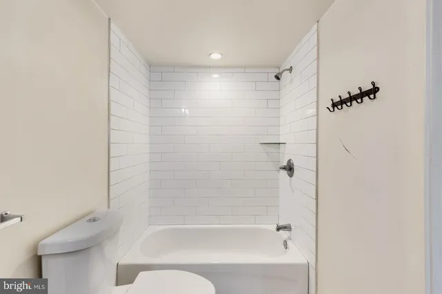 a bathroom with a bathtub and shower
