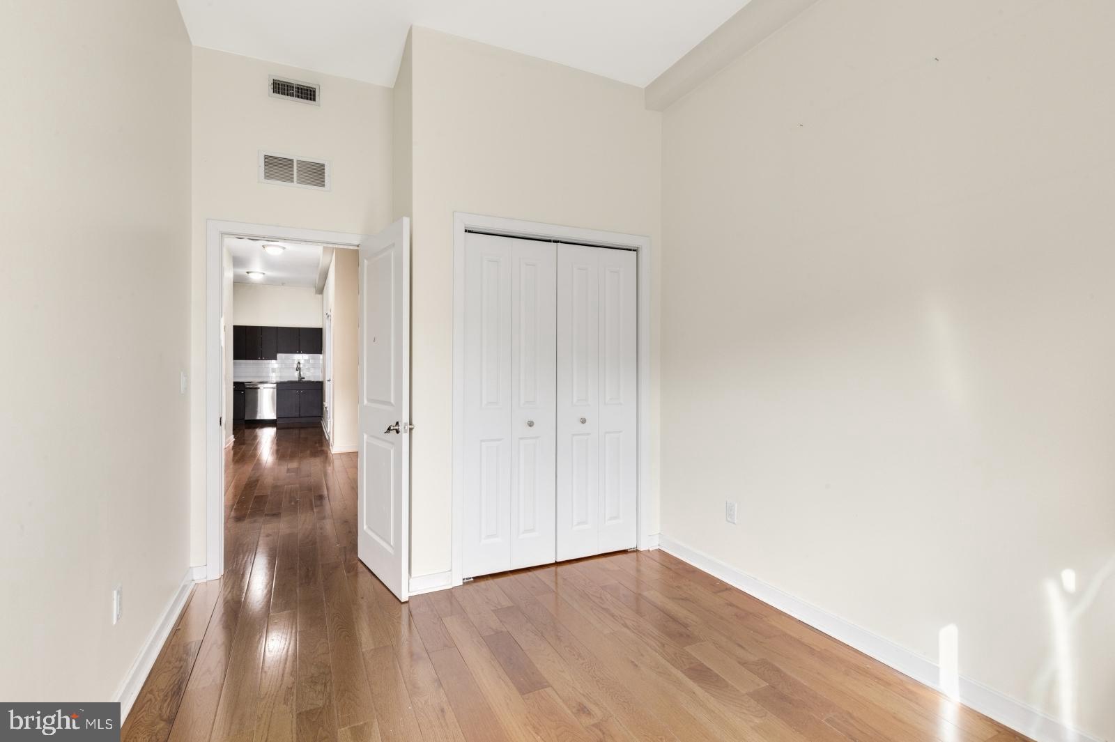 2031 South Juniper Street, Unit 204 Philadelphia, PA 19148 - Photo 19 of 31 a view of a hallway with wooden floor