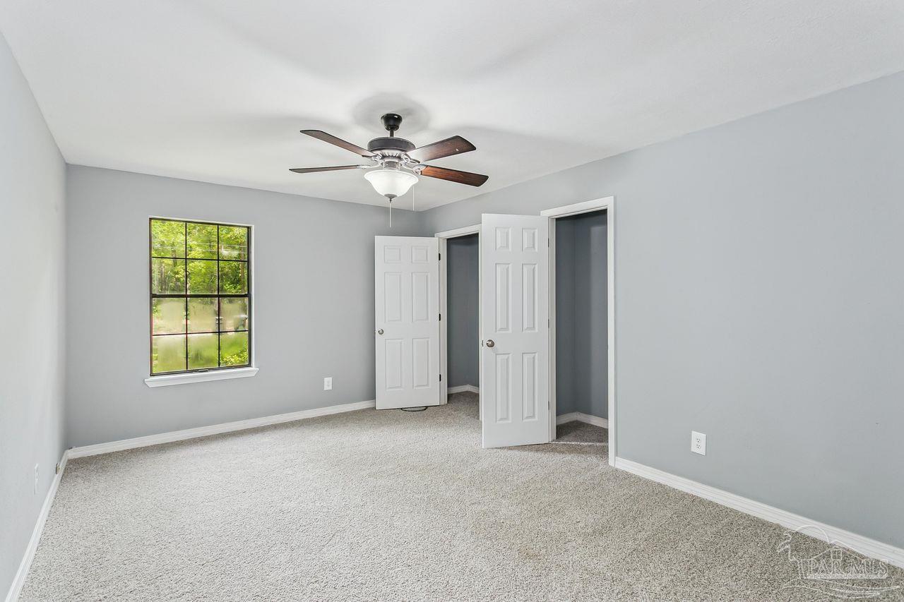 111 Cotton Creek Road McDavid, FL 32568 - Photo 17 of 37 a view of an empty room with a window