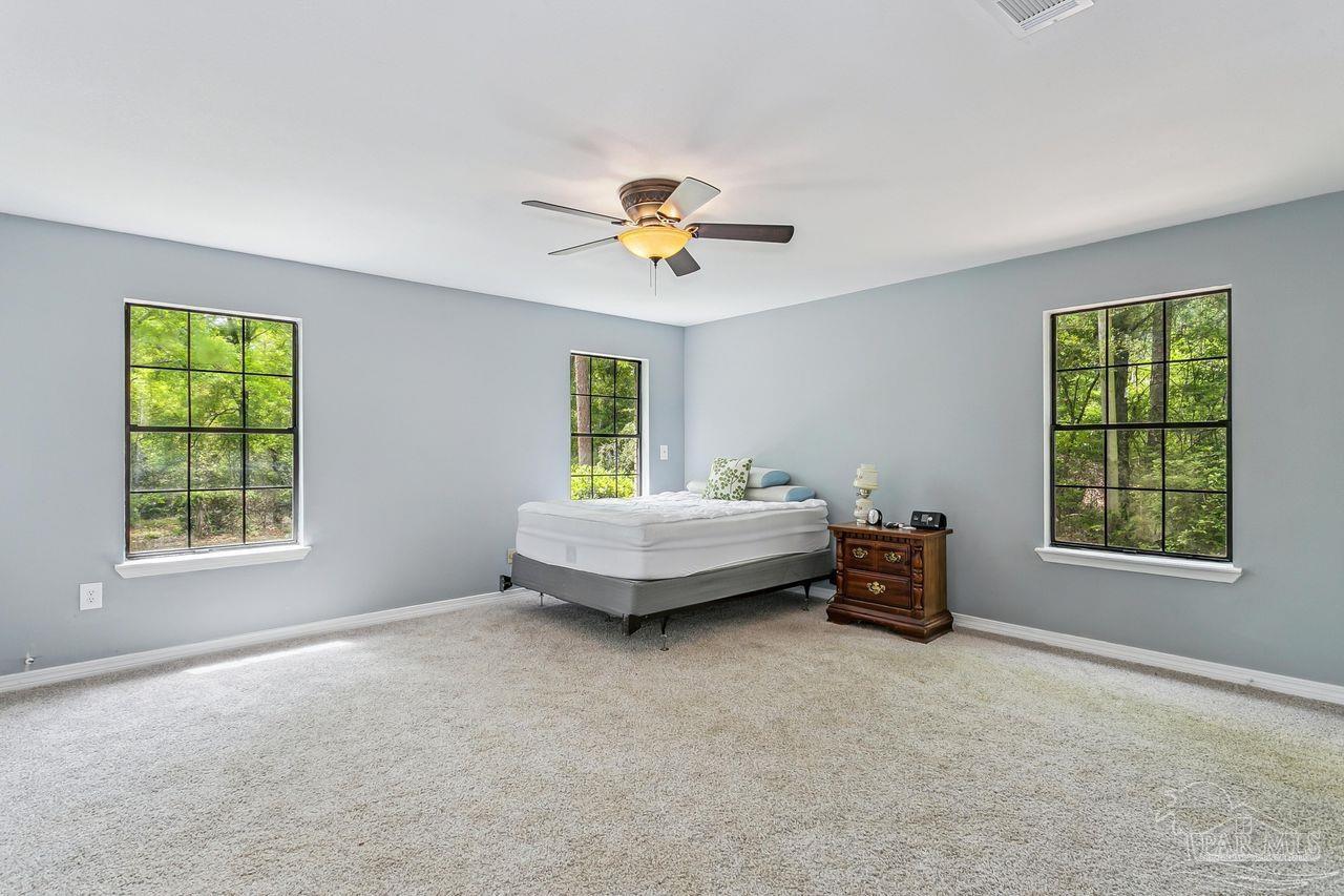 111 Cotton Creek Road McDavid, FL 32568 - Photo 22 of 37 a living room with furniture and a window