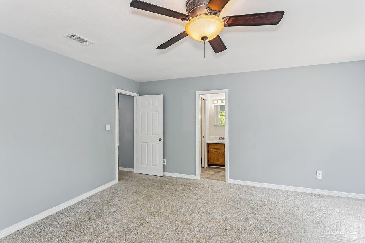 111 Cotton Creek Road McDavid, FL 32568 - Photo 23 of 37 an empty room and chandelier fan