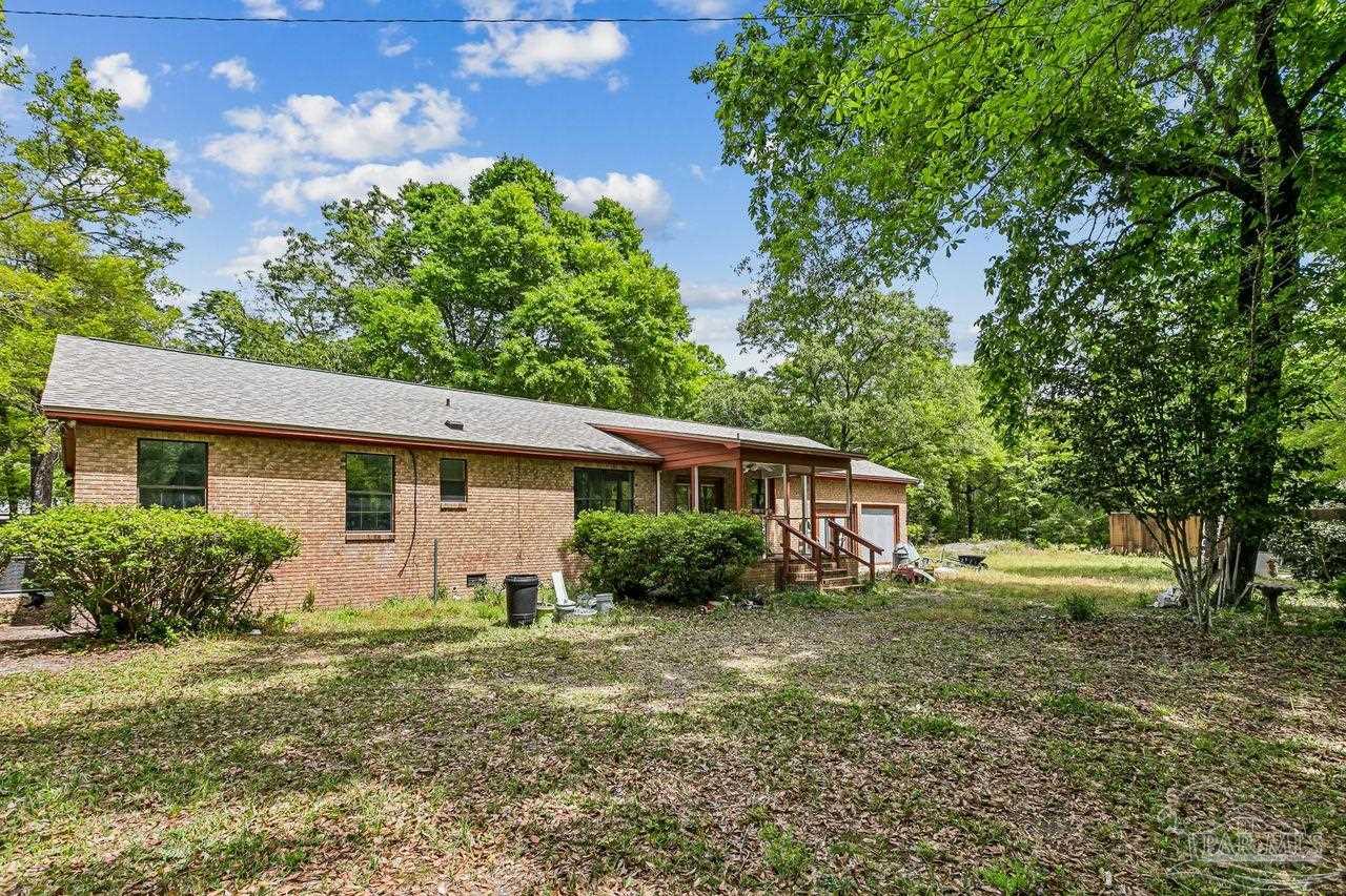 111 Cotton Creek Road McDavid, FL 32568 - Photo 28 of 37 a house view with a garden space