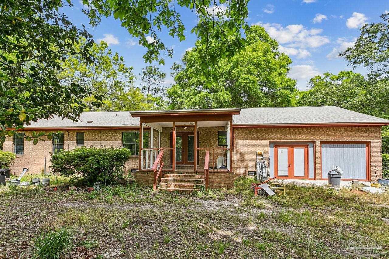 111 Cotton Creek Road McDavid, FL 32568 - Photo 29 of 37 front view of a house with a yard