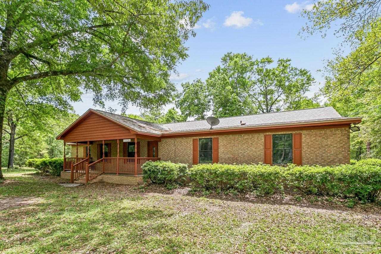 111 Cotton Creek Road McDavid, FL 32568 - Photo 3 of 37 a front view of a house with garden