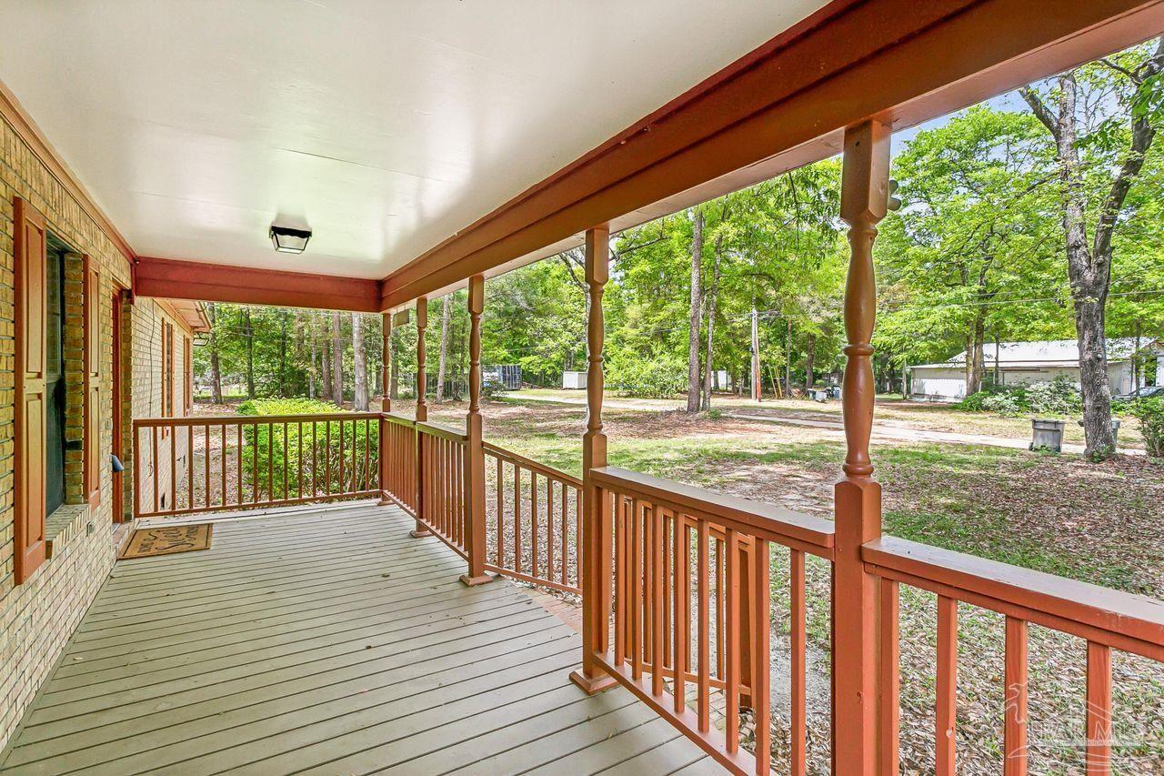 111 Cotton Creek Road McDavid, FL 32568 - Photo 5 of 37 a view of a balcony with wooden floor