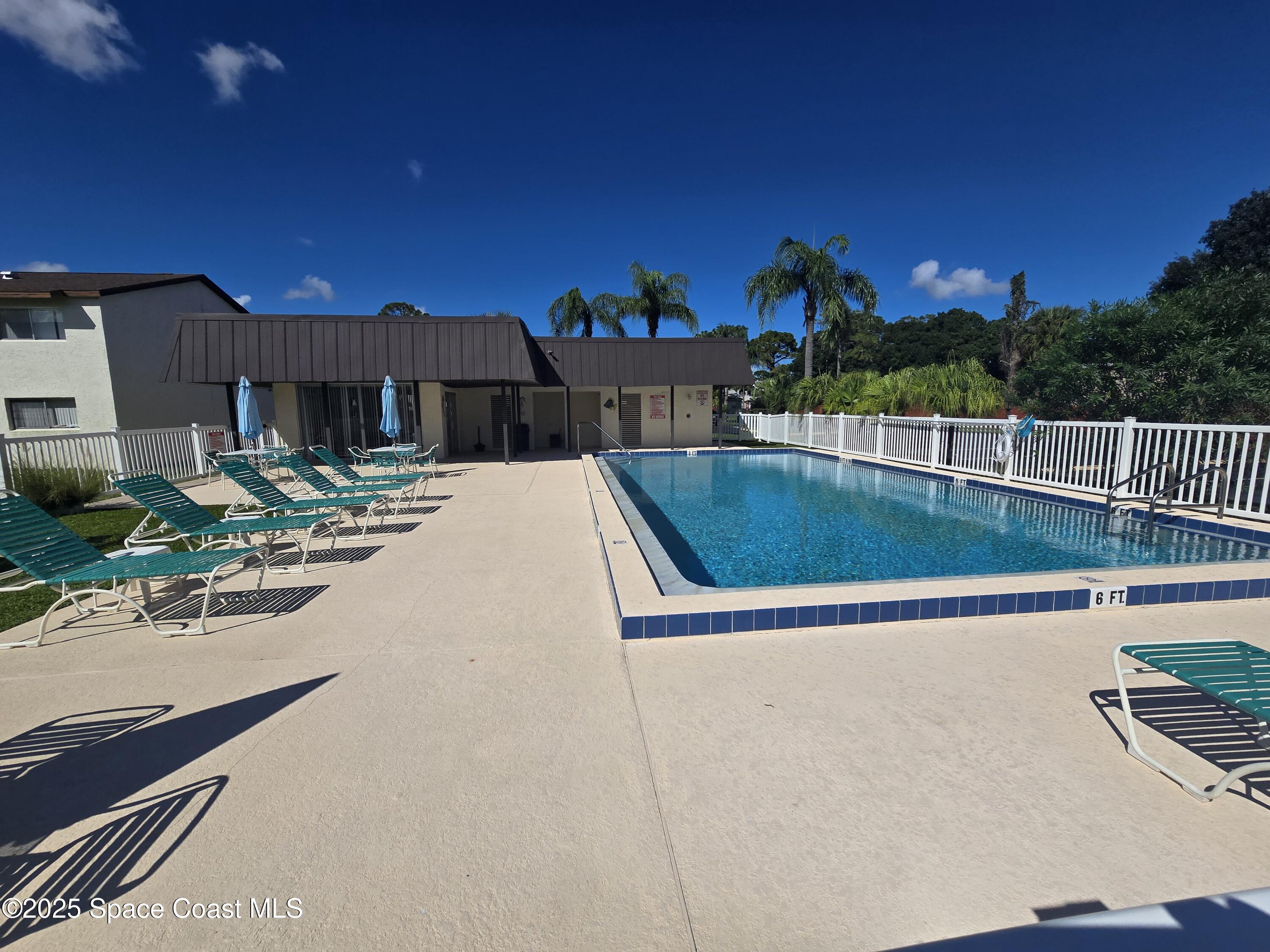 620 Ridge Club Drive, Unit 88 Melbourne, FL 32934 - Photo 17 of 18 a view of a swimming pool with a patio