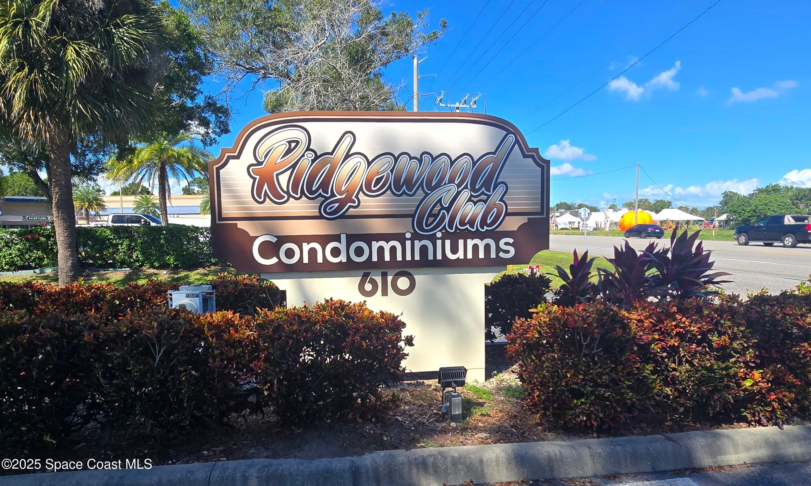 620 Ridge Club Drive, Unit 88 Melbourne, FL 32934 - Photo 18 of 18 a sign on the side of a building
