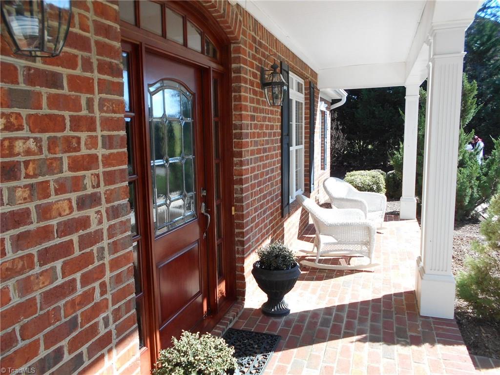 8643 Adkins Road Colfax, NC 27235 - Photo 2 of 30 Rocking chair front porch