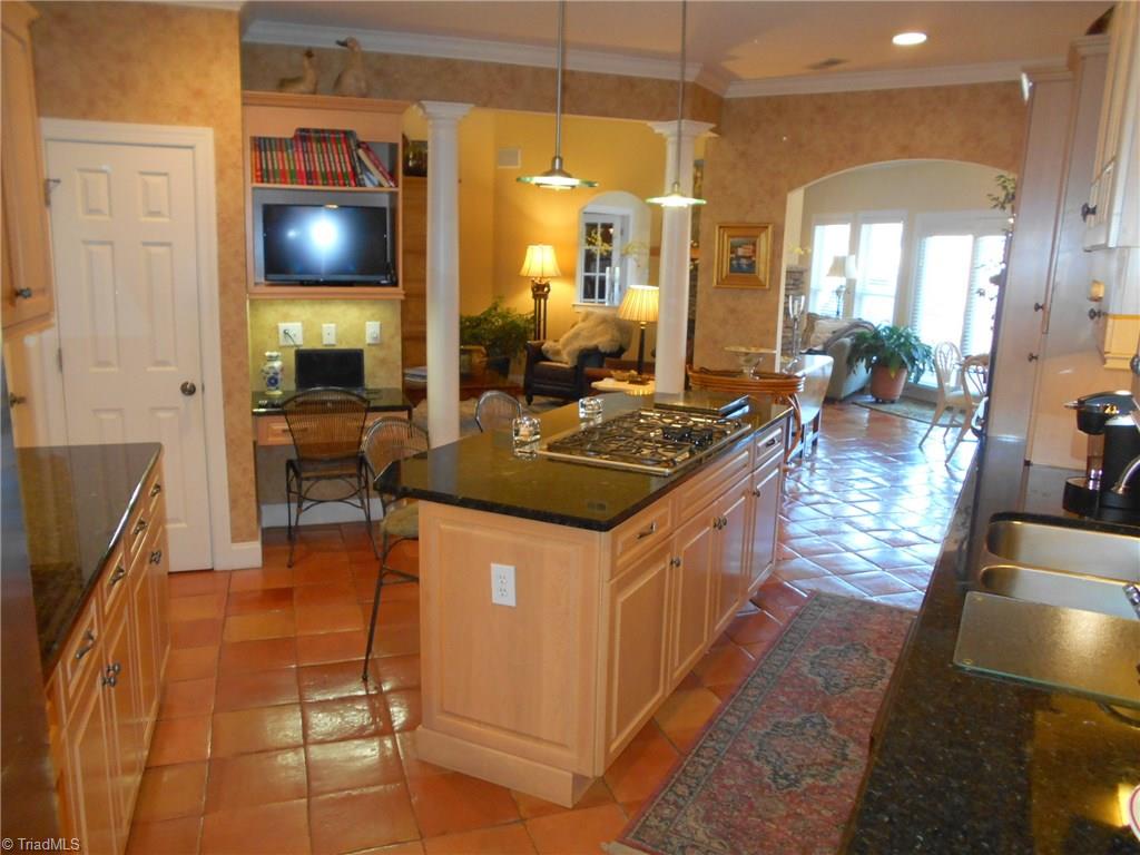 8643 Adkins Road Colfax, NC 27235 - Photo 10 of 30 Pantry and built in desk also in kitchen