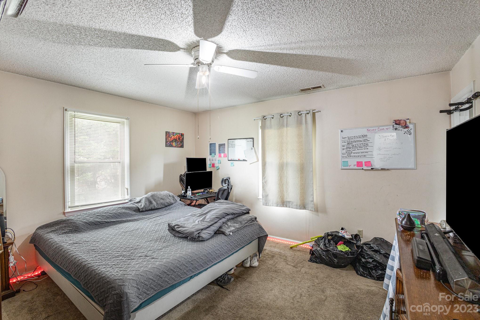 2781 St James Church Road Denver, NC 28037 - Photo 16 of 22 a room with furniture and a flat screen tv