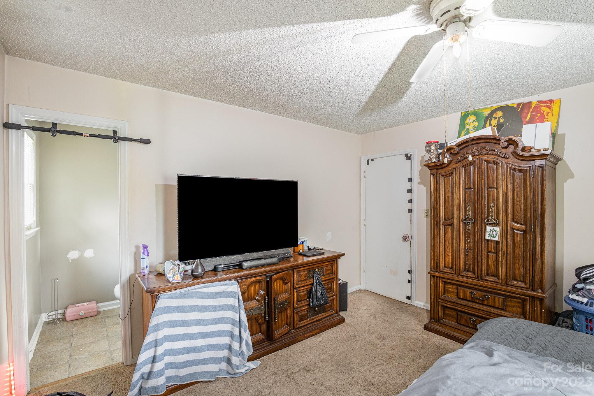 2781 St James Church Road Denver, NC 28037 - Photo 18 of 22 a living room with furniture and a flat screen tv