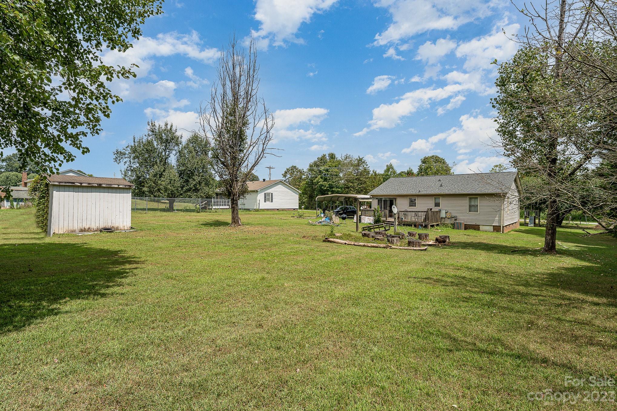 2781 St James Church Road Denver, NC 28037 - Photo 20 of 22 a front view of house with yard and seating