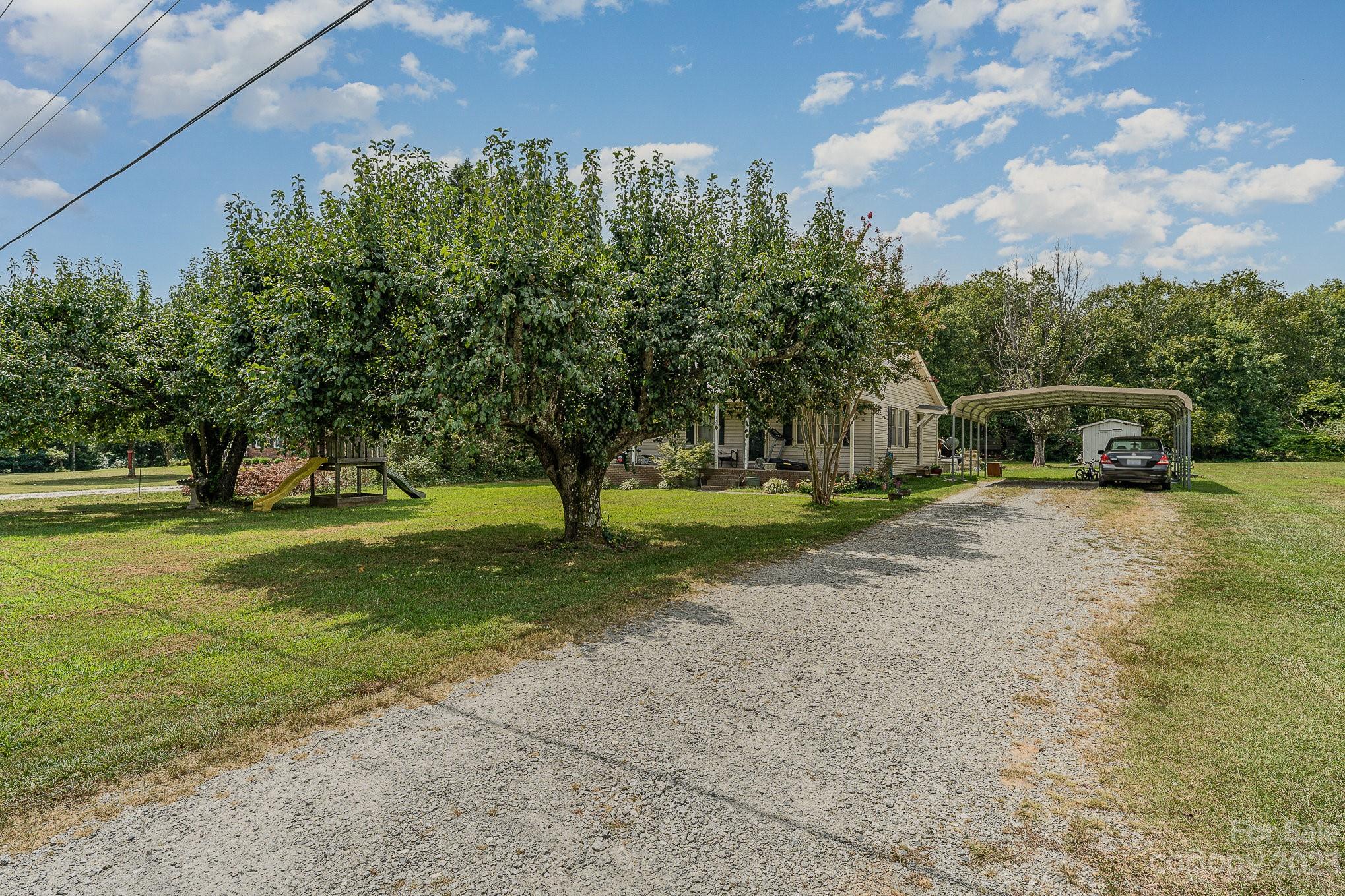 2781 St James Church Road Denver, NC 28037 - Photo 2 of 22 a view of a park with large trees