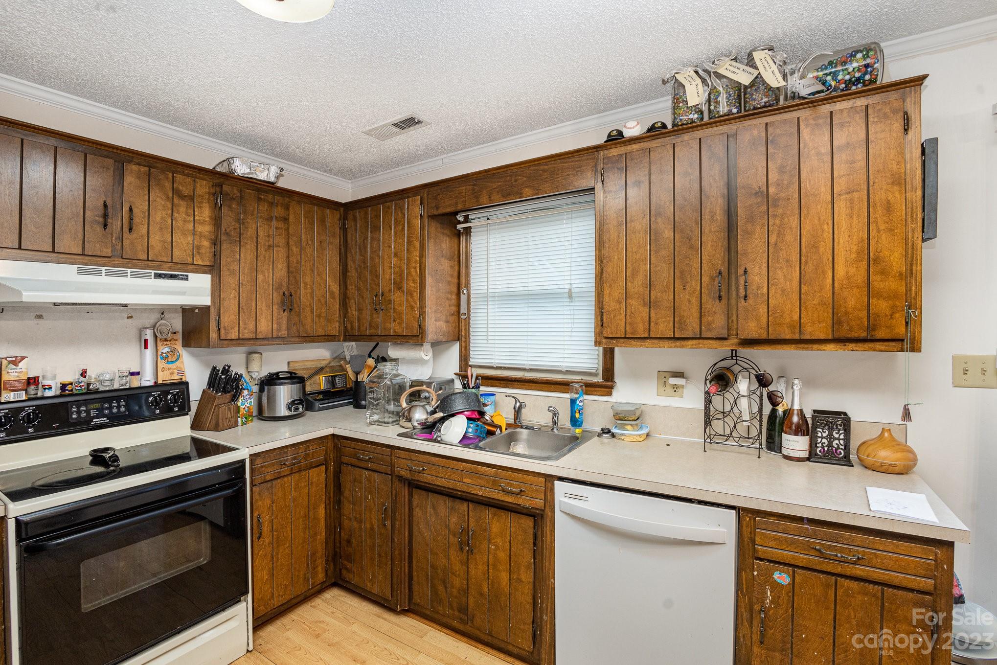 2781 St James Church Road Denver, NC 28037 - Photo 3 of 22 a kitchen with a sink cabinets and appliances