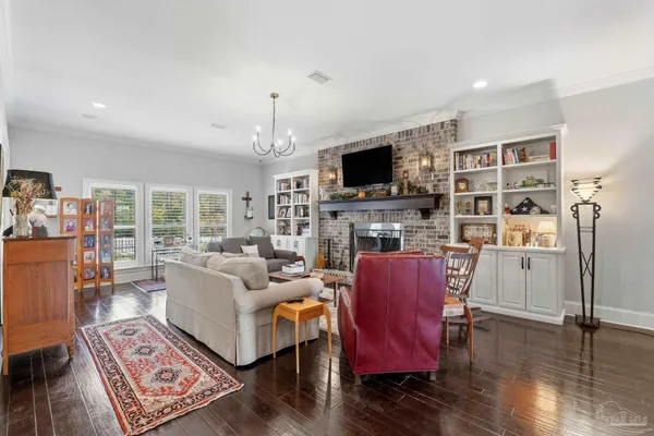 a kitchen with stainless steel appliances white cabinets and a refrigerator