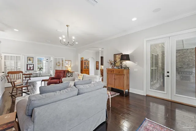 a bedroom with furniture and a rug