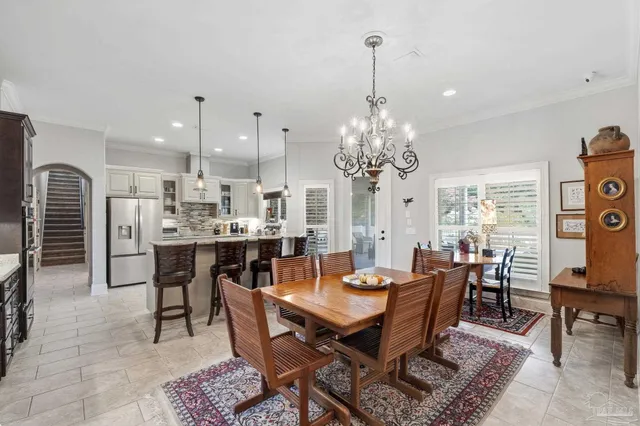 a bathroom with a double vanity sink a large mirror a shower and bathtub