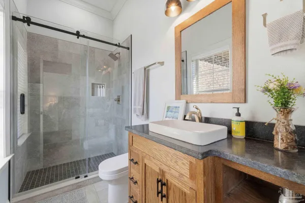 an empty room with closet and a ceiling fan