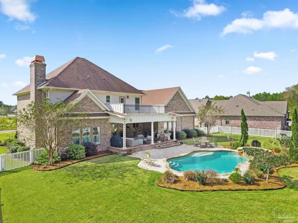 a living room with furniture and a lamp