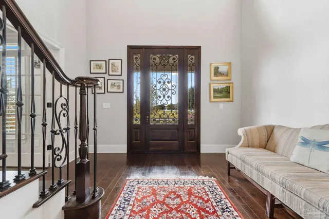 a view of a dining room with furniture and chandelier