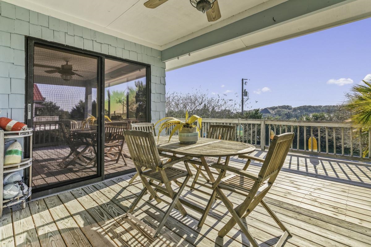 5484 5th Street St. Augustine, FL 32080 - Photo 23 of 37 a view of a balcony with chair and wooden floor