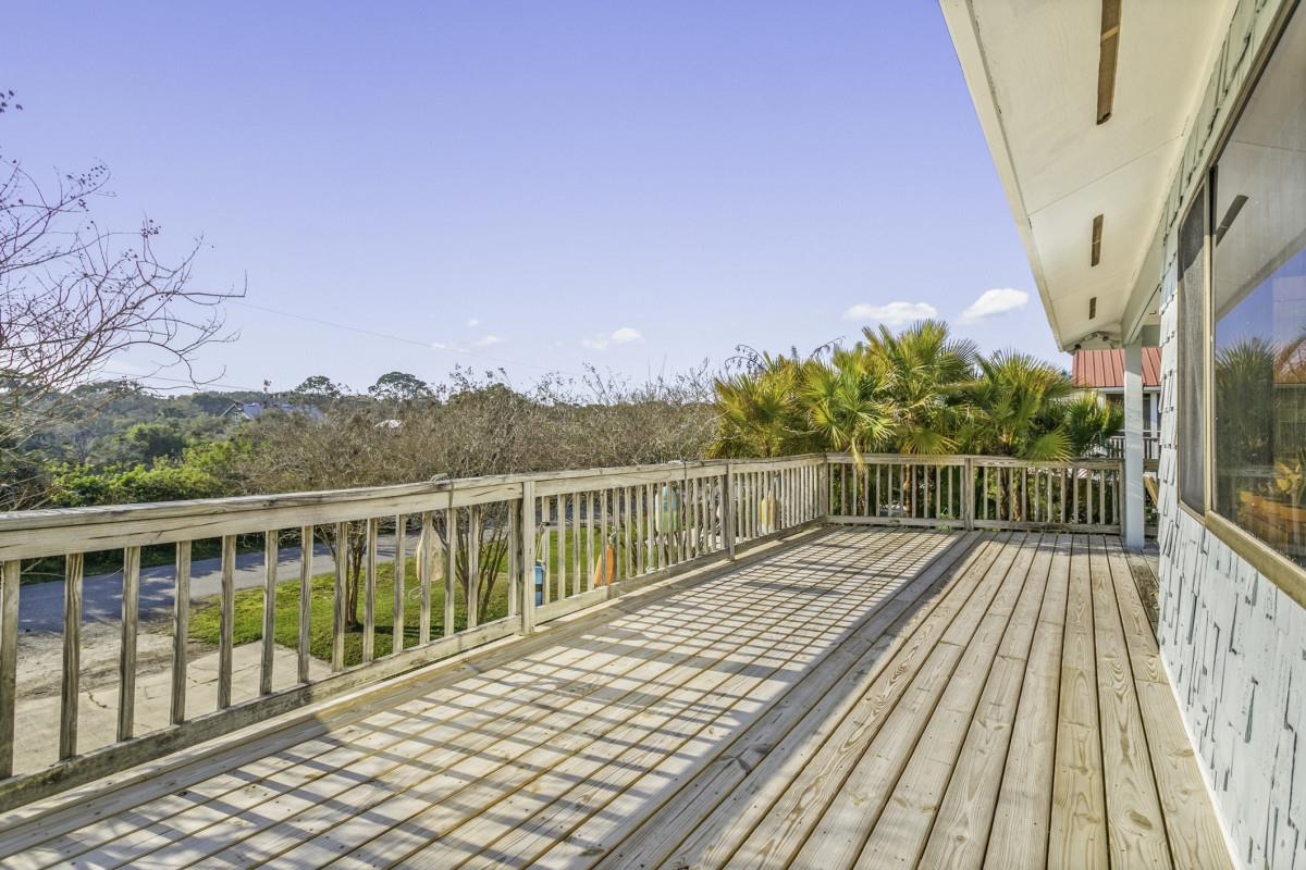 5484 5th Street St. Augustine, FL 32080 - Photo 24 of 37 a view of balcony with wooden floor and fence