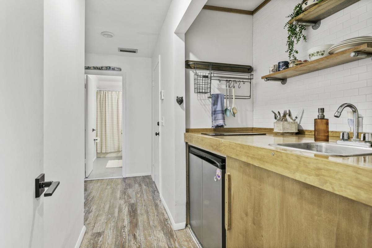 5484 5th Street St. Augustine, FL 32080 - Photo 29 of 37 a bathroom with a sink and a mirror