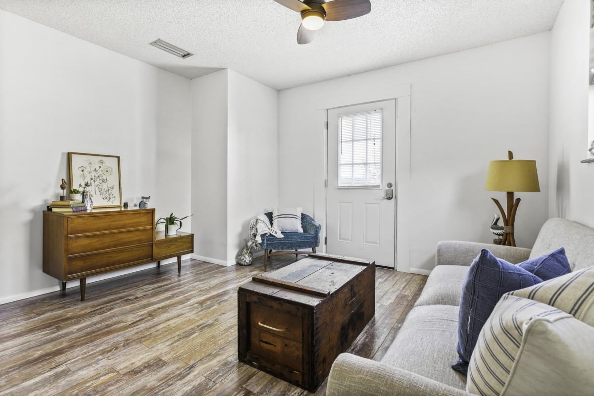 5484 5th Street St. Augustine, FL 32080 - Photo 33 of 37 a living room with furniture and a wooden floor