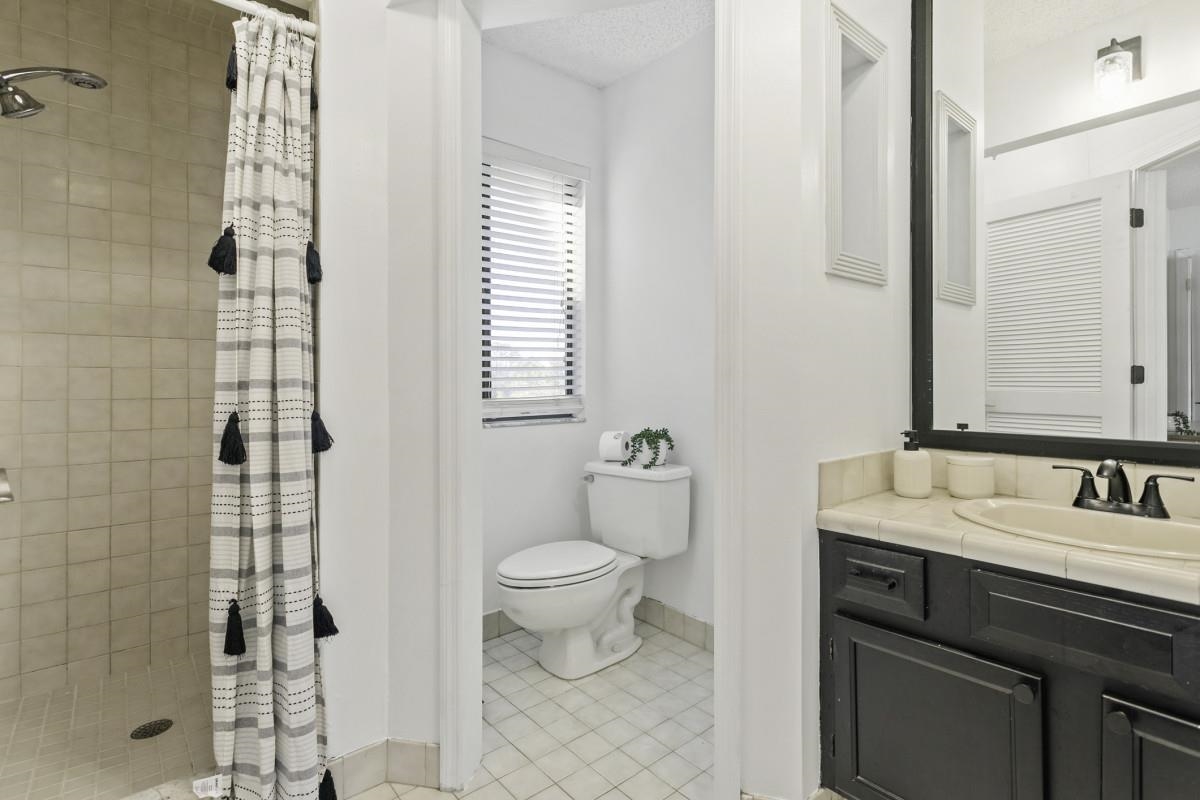 5484 5th Street St. Augustine, FL 32080 - Photo 10 of 37 a bathroom with a sink toilet and shower