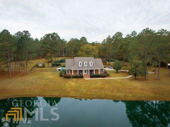 84 Johnson Farm Road Hazlehurst, GA 31539 - Photo 1 of 1 a view of a lake with houses