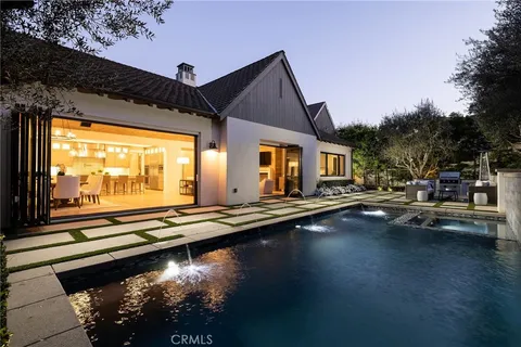 a view of swimming pool with outdoor seating and wooden floor