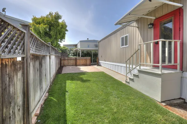 a view of a chairs and table on the deck