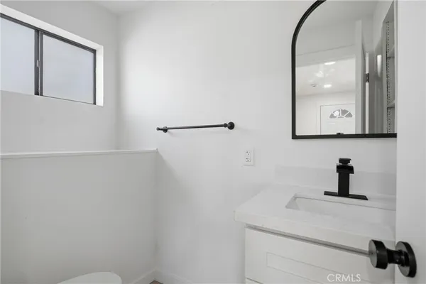 a bathroom with a sink and mirror