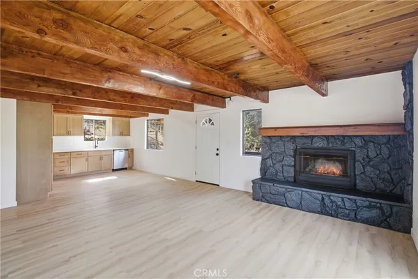 a view of an empty room with a fireplace