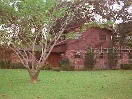 20015 Southwest 46 Avenue Gainesville, FL 32608 - Photo 1 of 1 a front view of a house with garden